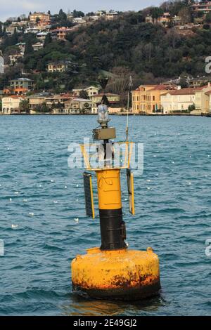 Yellow navigational buoy marker in a river Stock Photo