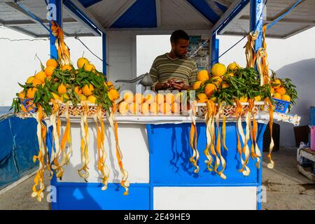 Street vendor selling home made orange juice. Essaouira, Morocco Stock Photo