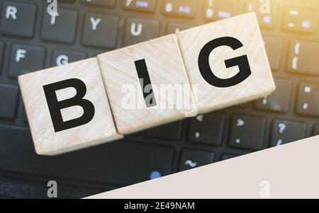 Wooden cubes with word BIG on computer keyboard. Big data business concept. Stock Photo