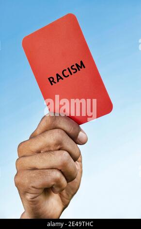 Man Holding Out a Racism red card Stock Photo