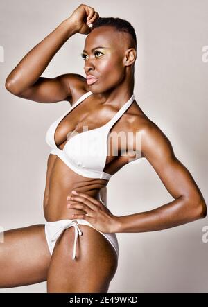 Young african woman posing in white bikini Stock Photo