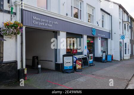 Bala; UK: Sep 20, 2020: The Coop supermarket on the High Street of Bala with outdoor signage giving their customers information about shopping in the Stock Photo