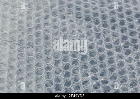 air bubble wrap - real life close-up background with selective focus and blur. Stock Photo