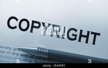 copyright printed word and luxury pen on paper, vintage style. Right protection concept. Stock Photo