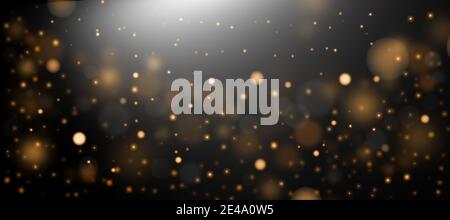 Golden abstract bokeh background. Defocused abstract flickering lights on a black background. Golden bokeh. Stock Photo