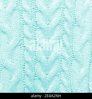 Turquoise knitted textured pattern background. Stock Photo