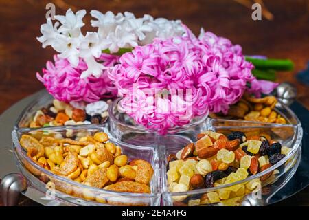 Appetite nuts and white and pink hyacinths flowers Stock Photo