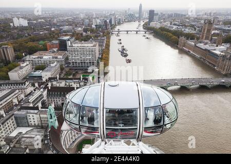 London, United Kingdom - October 31, 2017: Tourists are in a cabin of London Eye giant Ferris wheel in London Stock Photo