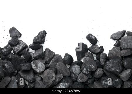 Black coal isolated on white background. Empty room for text. Top view Stock Photo