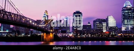 Suspension bridge across the Ohio River with skyscrapers in the background, Cincinnati, Ohio, USA Stock Photo