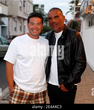 Jon Gosselin and designer Christian Audigier pose in front of the Tetou Restaurant in Saint-Tropez, France on July 13, 2009. Jon and Kate Plus 8 is a reality television show produced in the United States by Figure 8 Films about the Gosselin family, consisting of parents Jon and Kate and their eight children: fraternal twins and sextuplets. The show follows the family through their daily lives, focusing on the challenges of raising multiple children. The show is currently one of the highest rated programs on TLC and the fifth season premiere was seen by a record 9.8 million viewers, the most wa Stock Photo