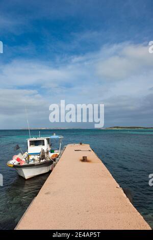 Motorboat moored at a pier, Plage De Calalonga, Bonifacio, Corse-Du-Sud, Corsica, France Stock Photo