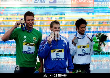 South Africa's Gerhard Zandberg, Great Britain's Liam Tancock and Japan's Junya Koga celebrates on the podium after the final of the 50 meters backstroke at the FINA Swimming World Championships in Rome, Italy, on August 2st, 2009. Photo by Henri Szwarc/ABACAPRESS.COM Stock Photo