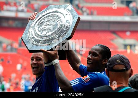 Chelsea's John Terry and Didier Drogba celebrate with the Community Shield trophy after winning the Community Shield soccer match between Manchester United and Chelsea at Wembley Stadium in London, Uk on August 9, 2009. Chelsea won 2-2 (4 penalties to 2). Photo by Henri Szwarc/ABACAPRESS.COM Stock Photo