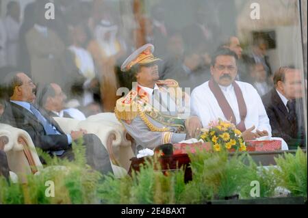 Libyan leader Muammar Gaddafi seen next to Sri Lanka's president Mahinda Rajapaksa during military parade organised in Tripoli, Libya, on September 1st, 2009, as part of many festivities to celebrate 40th anniversary of 'Al Fateh' revolution, lead by Muammar Gaddafi, on September 1st, 1969. The parade included bands from many countries, including French Legion Etrangere and was attended by many heads of state. Photo by Ammar Abd Rabbo/ABACAPRESS.COM Stock Photo