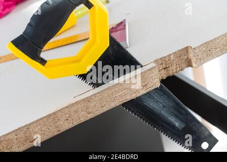 to cut holes in the kitchen countertop for equipment Stock Photo