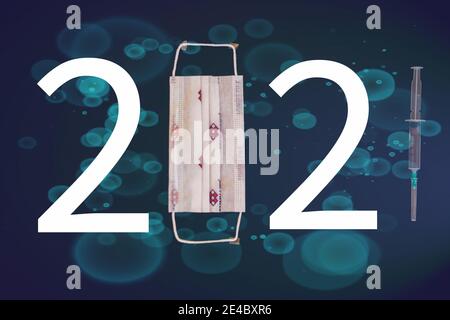 The number 2021 written with mask, number and syringe. A design considered due to Covid-19. Different symbols in the background. 2021 year themed. Stock Photo