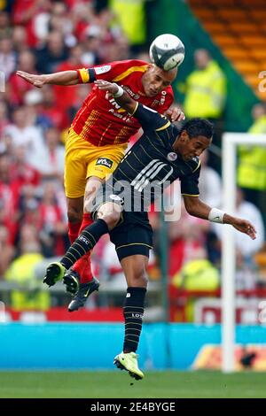Lens' Ala Eddine Yahia fights for the ball with Lille's Pierre-Emerick Aubameyang during the French First League Soccer Match, RC Lens vs Lille OSC at Felix Bollaert Stadium in Lens, France on September 20, 2009. The match ended in a 1-1 draw. Photo by Mi Stock Photo