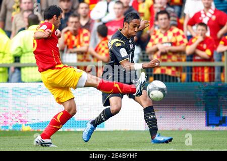 Lens' Fabien Laurenti fights for the ball with Lille's Pierre-Emerick Aubameyang during the French First League Soccer Match, RC Lens vs Lille OSC at Felix Bollaert Stadium in Lens, France on September 20, 2009. The match ended in a 1-1 draw. Photo by Mik Stock Photo
