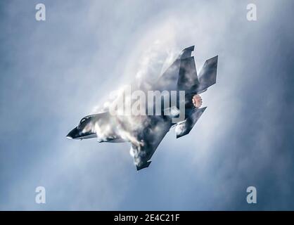 F-35 Lightning Jet producing sonic boom clouds Stock Photo