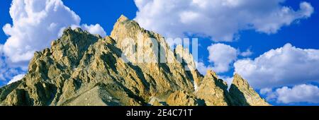 Low angle view of clouds over mountain peak, Exum Ridge, Grand Teton National Park, Wyoming, USA Stock Photo