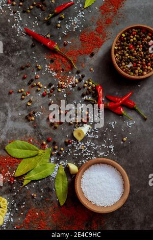 Dried powder of herbs and spices on dark background. Top view. Stock Photo