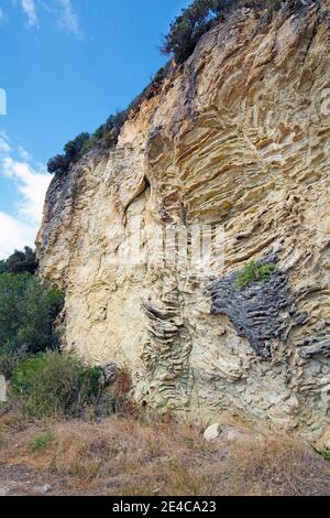 Soaring bizarre rock face, Karavostasi Beach, Epirus, Northern Greece Stock Photo