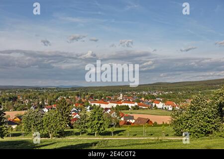 Germany, Thuringia, Gehren, town, overview, church, flowering chestnut trees, evening light Stock Photo