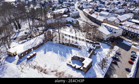 Germany, Thuringia, Gehren, houses, castle ruins, trees, snow, oblique view, aerial view, back light Stock Photo