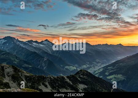 Sand in Taufers, Bolzano Province, South Tyrol, Italy. Sunrise at the summit of Speikboden Speikboden with a view over the Ahrntal to the peaks of the Zillertal Alps Stock Photo