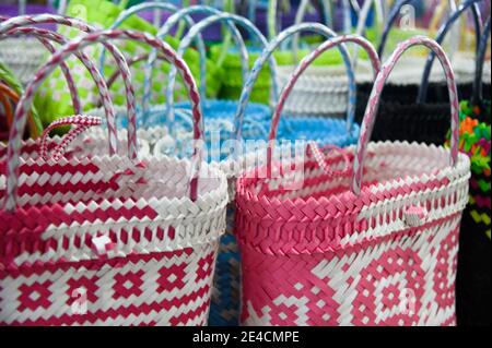 woven colorful baskets for sale in Asian market in Malaysia Stock Photo
