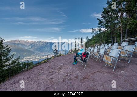 Verano, Province of Bolzano, South Tyrol, Italy. The Knottnkino on Rotsteinkogel, in the background the city of Merano and the peaks of the Texel group Stock Photo