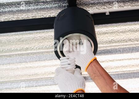 Replace the broken fluorescent light bulbs with LED bulbs. Stock Photo