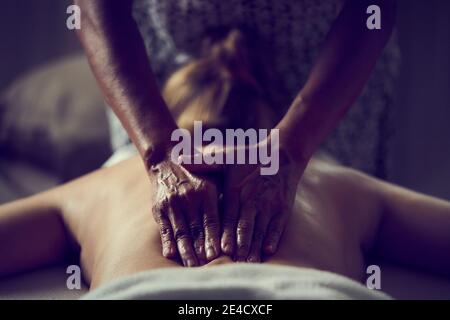 A woman having an oil massage Stock Photo