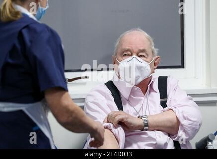 File photo dated 07/01/21 of Ian Cormack preparing to receive the Oxford/AstraZeneca coronavirus vaccine at Pentlands Medical Centre in Edinburgh, Scotland. A year has passed since the first people in Scotland were tested for coronavirus. Issue date: Saturday January 23, 2021. Stock Photo