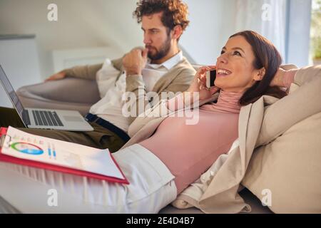 Male and female colleagues having a casual break together Stock Photo