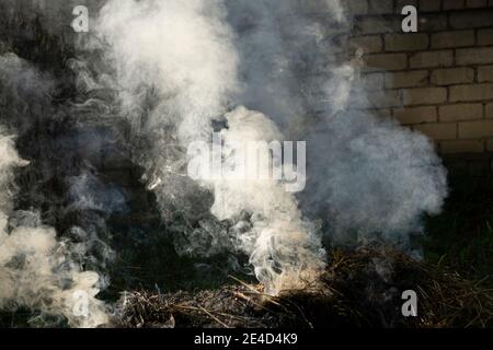 Background of an empty dark-black room. Empty brick walls, lights, smoke, glow, rays Stock Photo