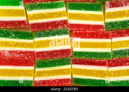 Colorful candies, jelly and marmalade on stone background. Top view with copy space Stock Photo
