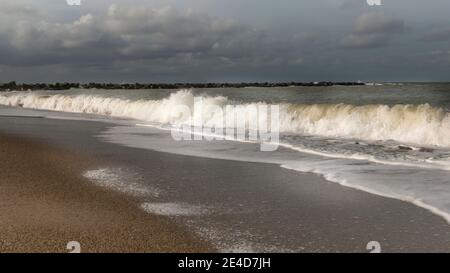 Thyboron, Denmark - 23 October 2020: Coast line at Thyboron on the Danish west coast, beautiful sandy beach, people on the beach, clouds in the sky, w Stock Photo