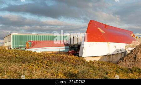 Thyboron, Denmark - 23 October 2020: Fishing cutters which are converted into a resturant, ship turned upside down and used for roofing, building rest Stock Photo