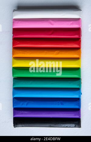 A set of colorful plasticine, modeling clay isolated on white background. Plasticine for children or professional modeling. Stock Photo