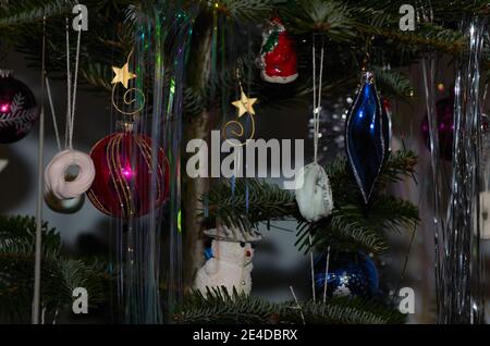 various colorful ornaments on the tree at Christmas Stock Photo