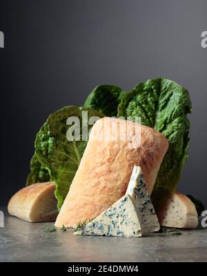 Blue cheese slices with bread, lettuce, and thyme. Stock Photo