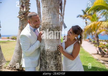 Newly wed couple looks at each other passionately after having celebrated the wedding Stock Photo