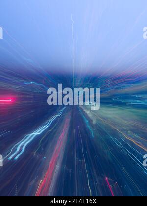 abstract light streak zoom burst pattern for background with blue tint Stock Photo