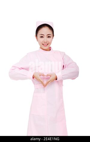 The young female nurses make heart gesture high quality photo Stock Photo