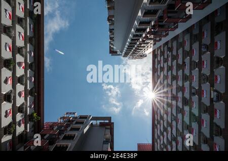 National flag of Singapore at HDB in Singapore to celebrate the National Day. The National Day of Singapore is celebrated every year on August 9. Stock Photo