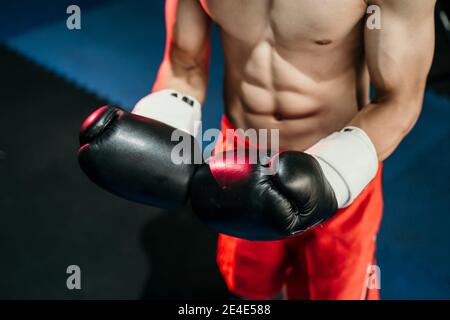 close up of boxer hand's in boxing gloves in the boxing ring background Stock Photo