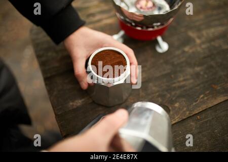 Process of making camping coffee outdoor with metal geyser coffee maker on  a gas burner, step by step. Travel activity for relaxing, bushcraft, advent  Stock Photo - Alamy