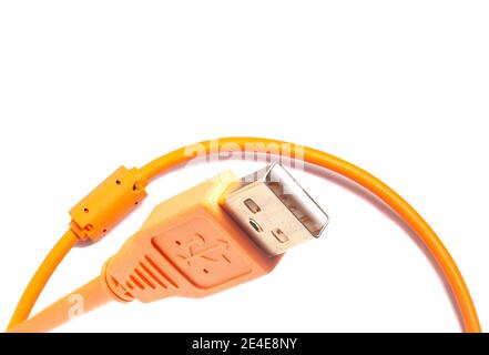 Orange USB cable isolated on white background. Stock Photo